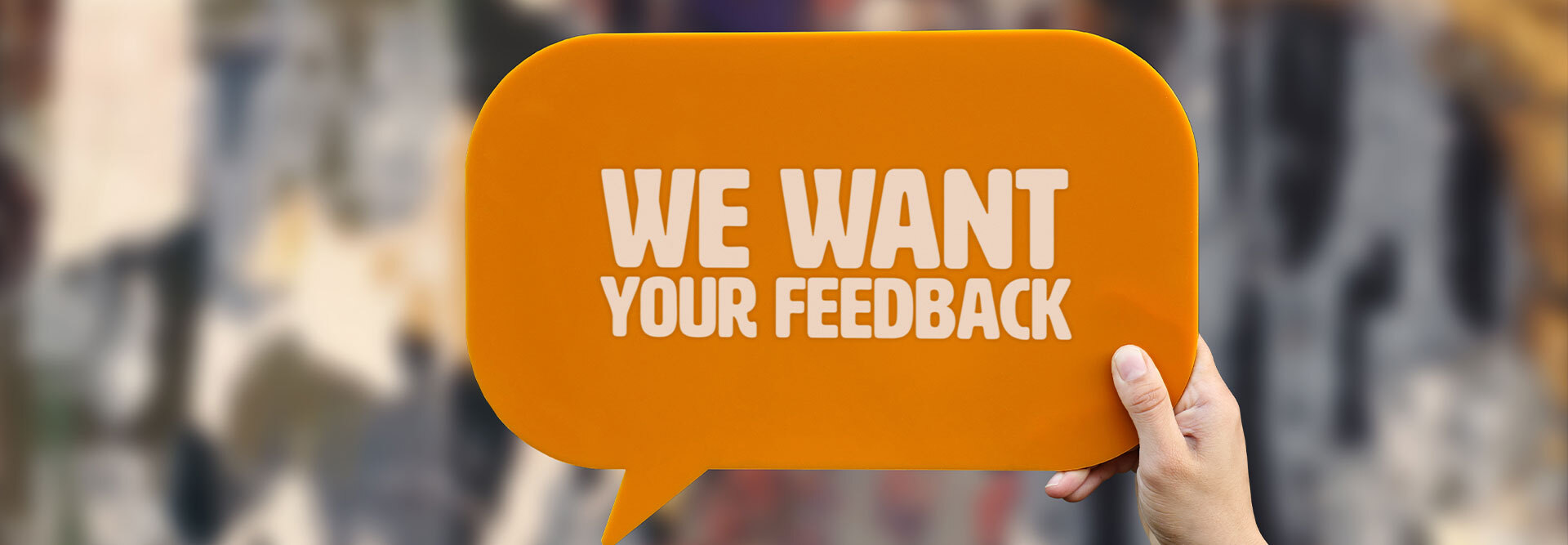 A speech bubble that states “We want feedback” to depict ways to instantly ask for a review request from happy customers.