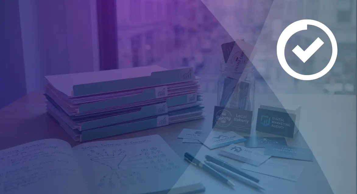 Agency desk with client folders and business cards showing how lead capture software supports scaling to more clients.