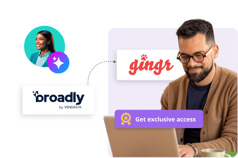 broadly and ginger graphics with a man looking at his laptop