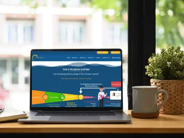 Laptop displaying Cyrusson website