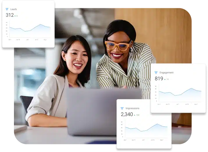 Two women looking at laptop reviewing website performance